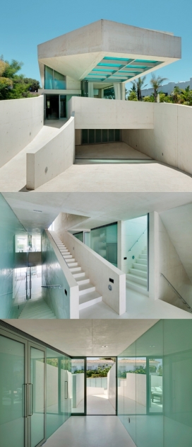 https://www.2008php.com/水母楼-房屋建筑位于西班牙，混凝土结构，楼高三层，顶部设有一个高架，有个透明的游泳池，让居民游泳和享受日光浴，还可以观赏地中海风景