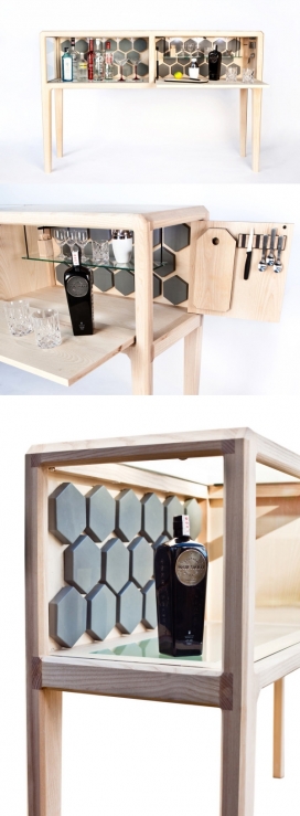 一个高端的手工六边形装饰酒柜-新西兰Ian Rouse设计师作品，采用美国水曲柳，真皮内饰和钢化玻璃镶板组合设计，橱柜分为两个方面，一个可以打开显示，另一个下拉门可兼作准备作品