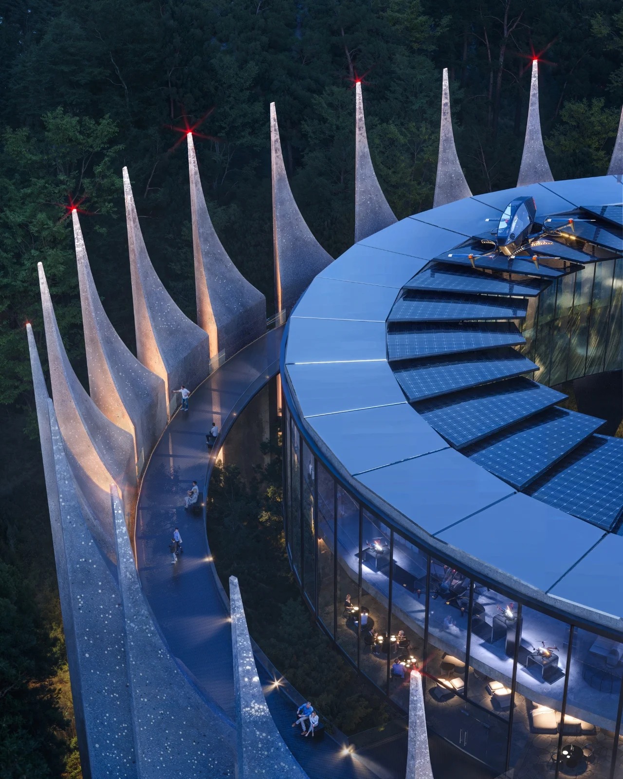 设计本身绝对令人惊叹。萨尼娜将这种美学描述为“哥特式未来主义者”,你可以理解为什么。同心环与古老的堡垒布局相呼应,锯齿状的混凝土墙以有节奏的山峰升起,与周围的山脊线相呼应。建筑不是与景观抗争,而是与景观对话